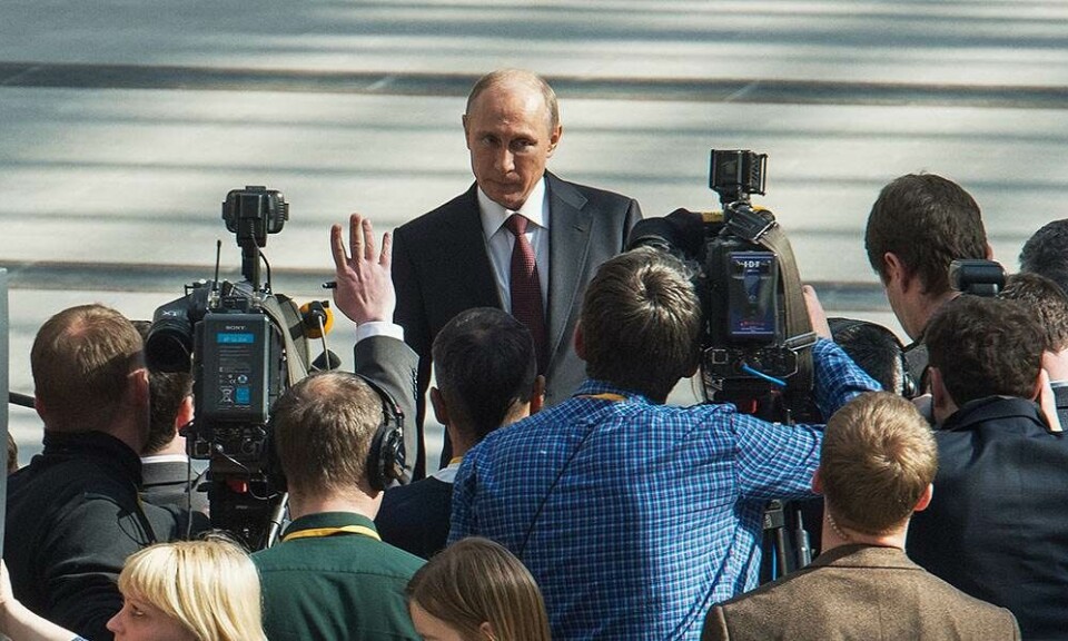 Vladimir Putin speaks to journalists