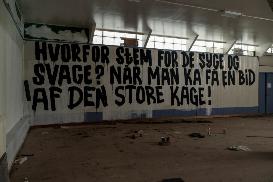 Dine penge mig i røven: Hvem er københavnerkunstneren bag byens mest berømte gavlmalerier?